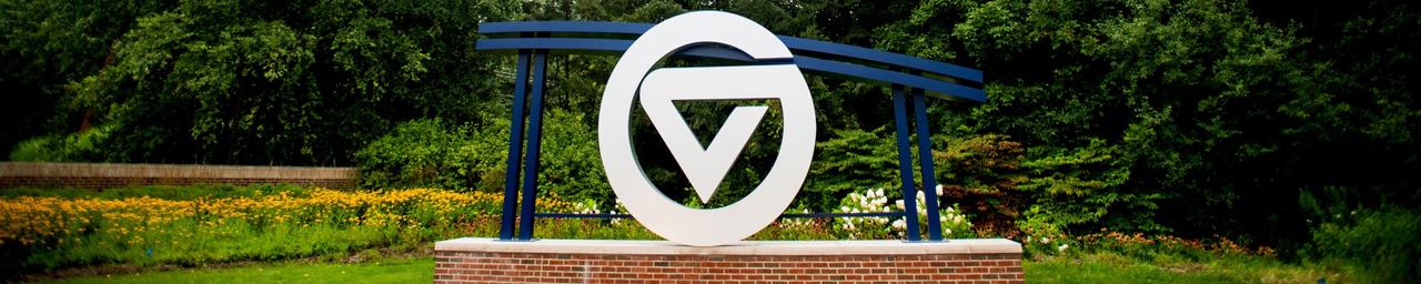 GV circle logo signage located in front of University entrance